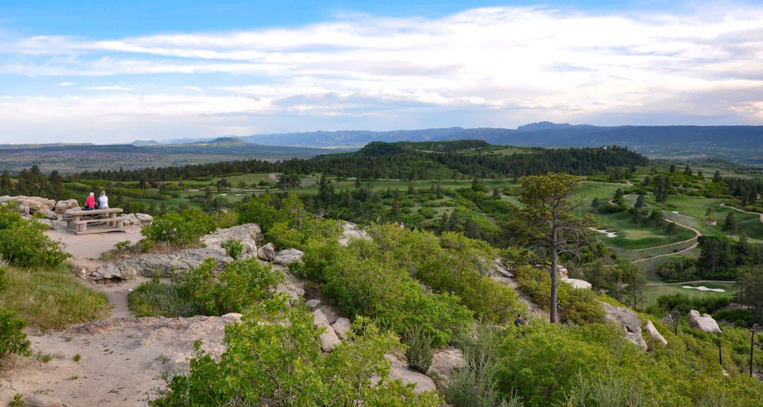 view from daniels park bluff toward front range mountains on hike near denver